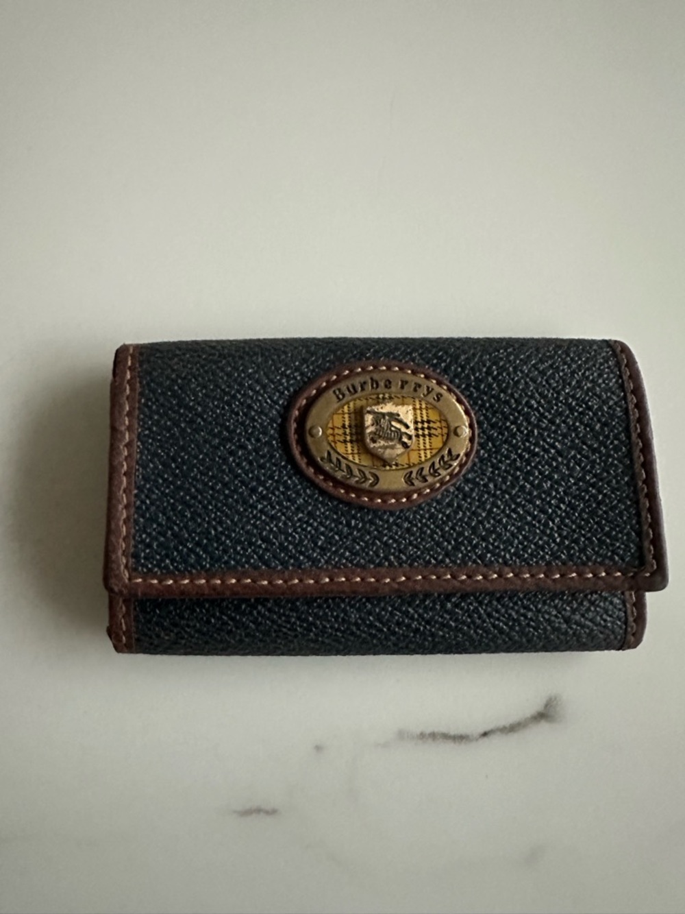 Burberry Black Textured Leather Key Case with Brown Trim and Brass Plaque